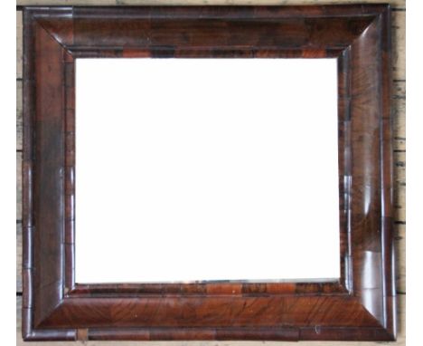 An 18th century and later walnut  cushion frame mirror, with bevelled plate, 60cm x 54cm (as found)
