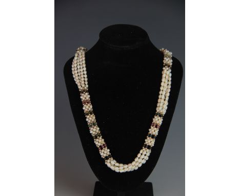 A five strand freshwater pearl and tourmaline bead necklace, with yellow metal clasp stamped '585', 67cm long 