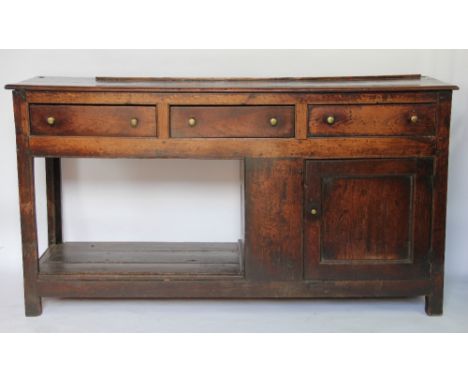 A George III oak dresser base, with three drawers above and cupboard and pot shelf, on square legs, 85cm H x 159cm W x 45cm D