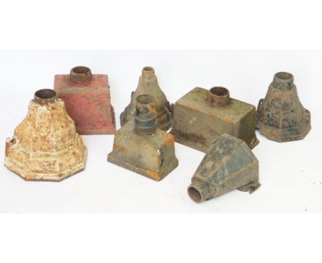 An assortment of eight cast iron drain pipe water hoppers