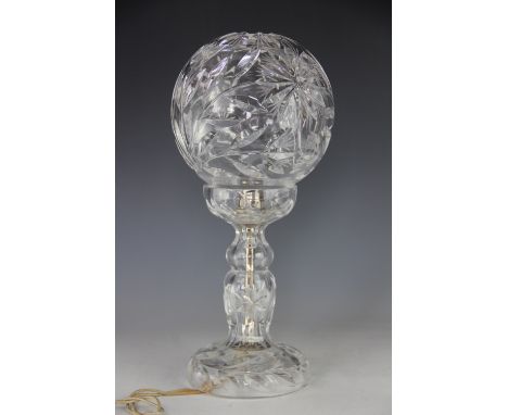 An early 20th century cut glass desk lamp, with spherical shade, 35cm high