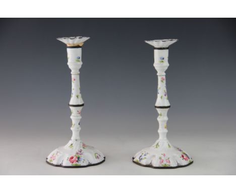 A pair of late 18th century South Staffordshire enamel candlesticks, with detachable nozzles, decorated with floral sprigs, 2