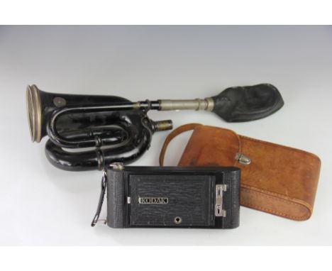 A Desmo, Birmingham car horn and a Kodak camera 'No 1A Pocket Kodak' in leather case, and a mahogany hanging corner cabinet o