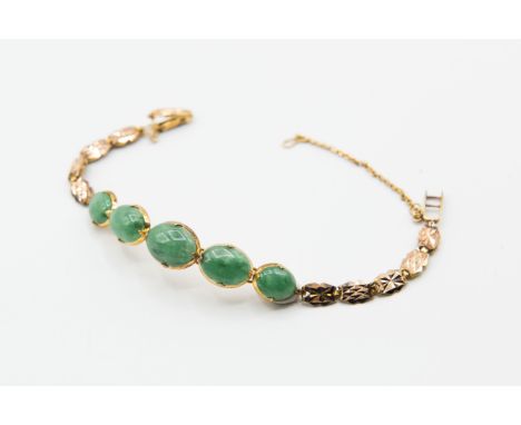 A JADE BRACELET, the five graduating oval cut polished jade plaques set on articulated links on a fancy articulated link brac
