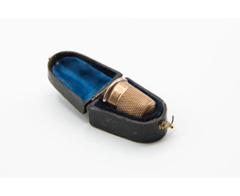 A CHARLES HORNER 9 CARAT GOLD THIMBLE, CHESTER, with presentation inscription dated 1900-1910, in a fitted case.