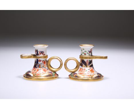 A PAIR OF SPODE CHAMBERSTICKS, EARLY 19TH CENTURY, decorated in an Imari palette to pattern number 967. 6.5cm high