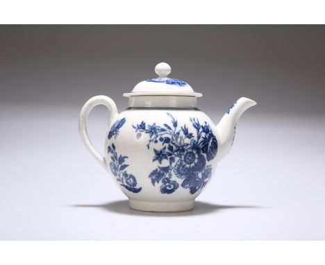 A CAUGHLEY PORCELAIN TEAPOT AND COVER, c. 1780, transfer printed in underglaze blue in the Three Flowers and Butterfly patter