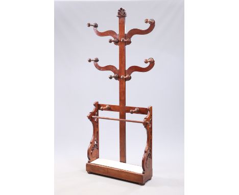 A VICTORIAN MAHOGANY "TREE" HALLSTAND, with four branches, complete with ten turned pegs and drip tray, raised on flattened b