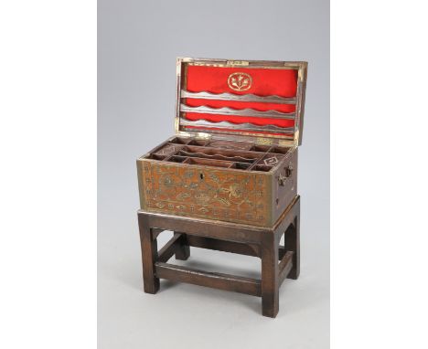 A BRASS AND ROSEWOOD CHEST ON STAND, EARLY 19TH CENTURY, the chest of rectangular form with substantial brass carrying handle