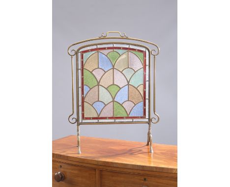 AN EARLY 20TH CENTURY BRASS, LEADED AND STAINED GLASS FIRESCREEN. 74.5cm high, 57cm wide