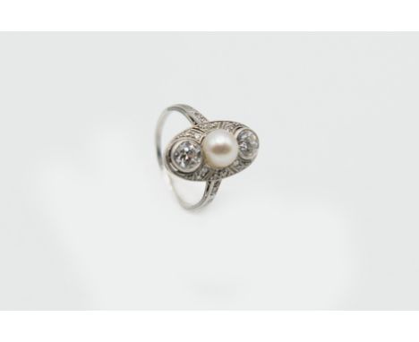 AN EDWARDIAN CULTURED PEARL AND DIAMOND RING, the oval mount set to the centre with a single cultured pearl between two princ
