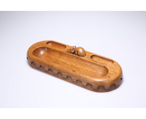 ROBERT THOMPSON OF KILBURNA MOUSEMAN OAK PEN TRAY, rounded rectangular with a pair of small wells and a large well, the sides