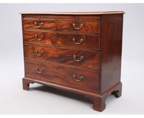 A GEORGE III MAHOGANY CHEST OF DRAWERS, the rectangular top with applied moulded edge over a slide with two short over three 