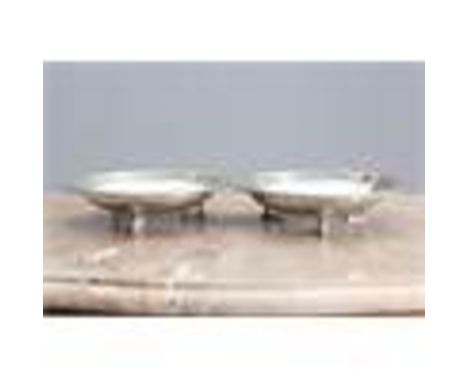 A PAIR OF LIBERTY &amp; CO TUDRIC PEWTER SHALLOW BOWLS, DESIGNED BY ARCHIBALD KNOX, each cast in low relief to the rim with s