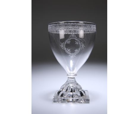 A LARGE GEORGIAN RUMMER, c. 1800, with pointed funnel bowl finely engraved with a central floral cartouche, the rim with an e
