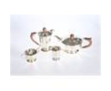 A SILVER FOUR PIECE TEA SERVICE, Mappin &amp; Webb, Sheffield 1958 and 1959, each piece of faceted form. Gross 46.5oz