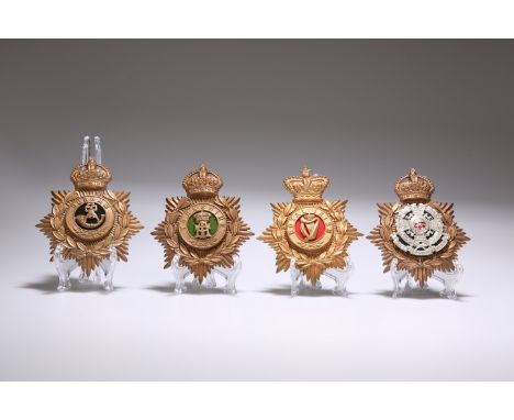 FOUR BRITISH MILITARY HELMET PLATES, the Durham Light Infantry, Yorkshire Regiment, The Border Regiment and the Royal Irish (