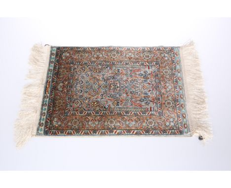 A TURKISH MINIATURE SILK PRAYER RUG, worked with a vase, birds and flowers within the arch, and with floral triple border, on