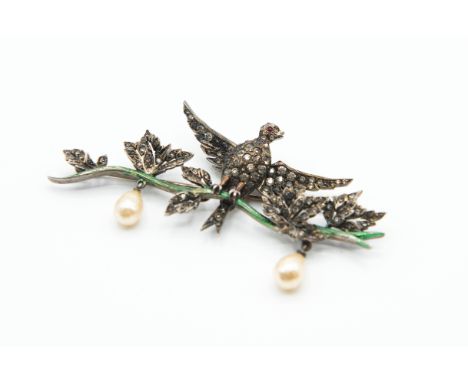A 1950'S VINTAGE DIOR BROOCH, the bird with spread wings en tremblant, set throughout with graduating clear pastes, to the ce