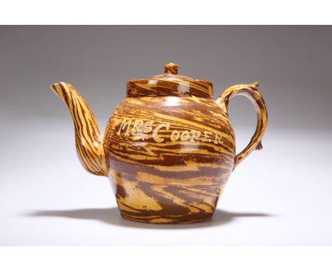 AN ENGLISH SLIPWARE COMMEMORATIVE DOUBLE-SPOUT TEAPOT, of spherical form, inscribed "Coronation June 26 1902..Mrs Cooper". Le