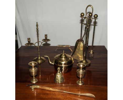 A brass fire tidy, candlestick, teapot and other brass items