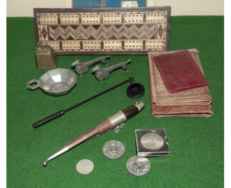 A cribbage board, wallets and other items