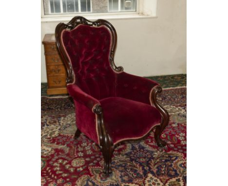 A Victorian button backed armchair