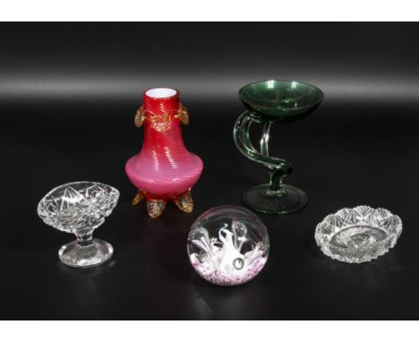 A glass paperweight, vaseline glass vase and three other items