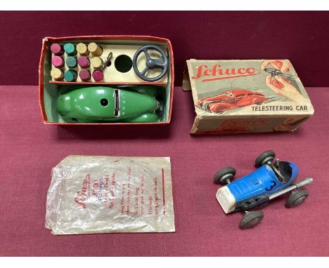 An Original Schuco 3000 Telesteering Car, green, working clockwork with accessories, in poor box, plus an original Schuco Mic