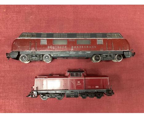 Two HO scale German DB Diesel locomotives by Fleischmann: a V200 B-B and a V100 Centre Cab B-B (marked "DCC" on underside), b