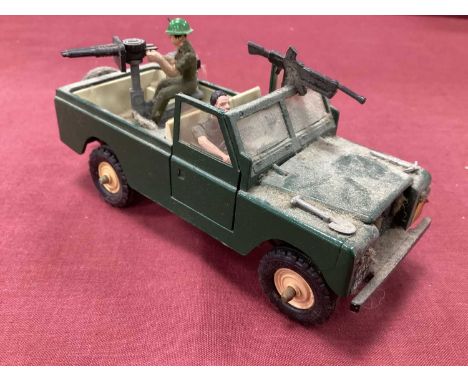 A 1970's Britains Military Land Rover and Crew, appears complete and would benefit from a clean.