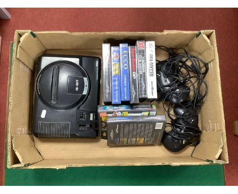 A Sega Mega Drive 16-Bit Games Console and two control pads, (untested for working order). Together with Eight Mega Drive Gam