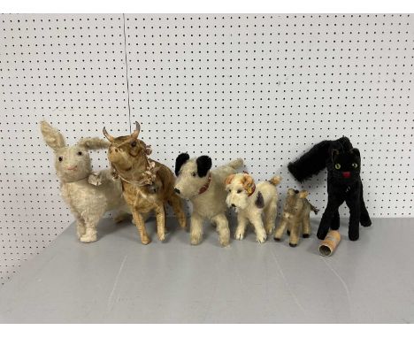 Six Mid XX Century Soft Toys, all with an animal theme, including a Steiff Dog (missing button), all well loved.