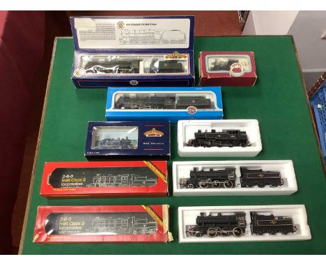Six boxed ex-LMS 00 gauge locomotives: two Hornby Ivatt Class 2 2-6-0s, a Bachmann Ivatt tank engine, an Airfix Royal Scot (t