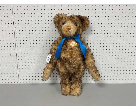 A Steiff "Petsy" 1928 Replica Growler Teddy Bear, With Name Tag and Blue Bow Tie To Neck. Measuring Approximately 42cm Tall.