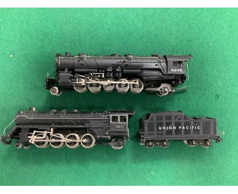 Two HO scale US outline steam locomotives: a diecast Fleischmann Union Pacific 2-8-2 and tender, and a Rivarossi 2-10-2 witho