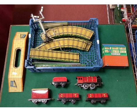A Post-War Tinpate 'O' Gauge Train Set by Chad Valley, including locomotive, rolling stock, track and accessories, playworn, 