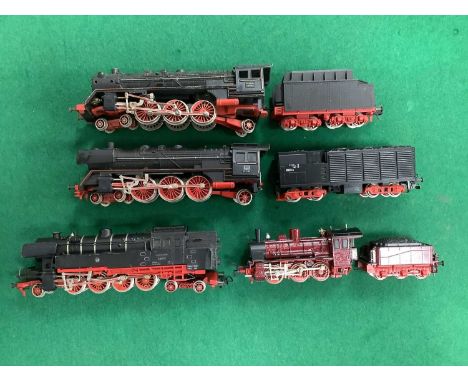 Four Fleischmann HO scale German locomotives: a 2-8-4 tank engine; an 0-6-0 and tender (apparently repainted); an 01 class Pa