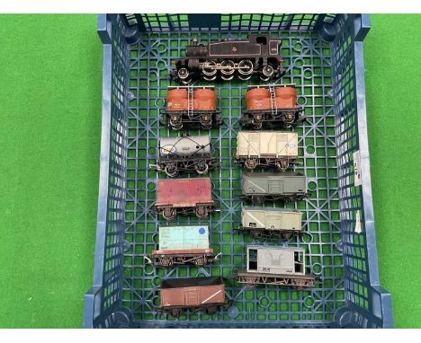 A 00 gauge mixed goods train comprising a Lima 45xx 2-6-2 tank engine in BR black, nine wagons and a brake van by Hornby, Dap