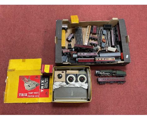 A quantity of Trix 00 gauge model railway equipment, including a Britannia locomotive, twelve coaches, approximately twenty w