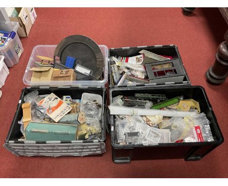 A large quantity (in four tubs) of model railway workshop items, including buildings, rolling stock components and tools.