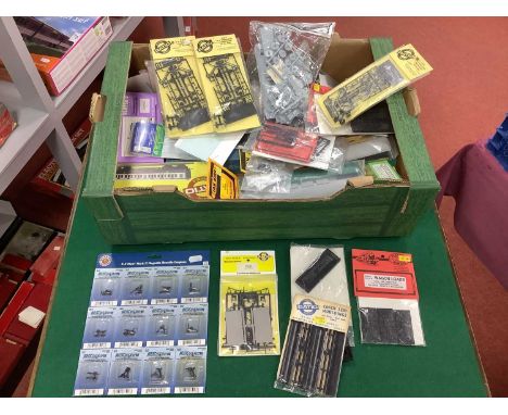 Approximately thirty 4mm scale coach and wagon kits by Airfix, Comet, Ratio, Slaters, Ian Kirk, Jenny Kirk and others togethe