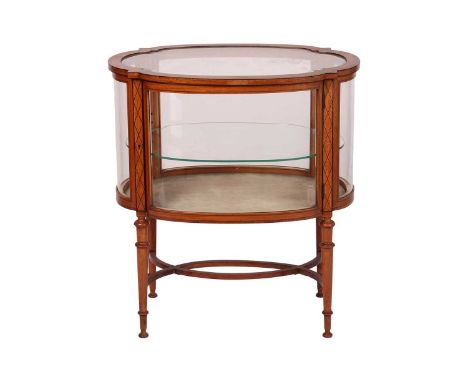 An Edwardian figured satinwood and ebony strung oval vitrine, with a bevelled and shaped top panel above a single shelf and s