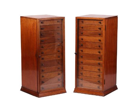 A pair of bespoke mahogany fountain pen collectors pedestal cabinets, each with a single glazed door enclosing twelve short d