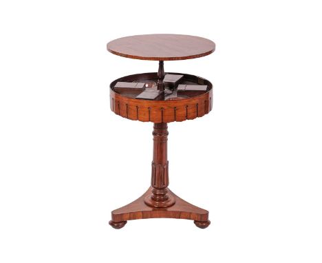 A 19th-century circular drum-top rise and fall rosewood teapoy / Surprise table on a triform base. Fitted interior with four 