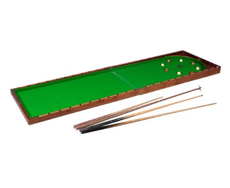 A MAHOGANY FOLDING TABLE-TOP BAGATELLE BOARD early 20th century, the panelled and hinged mahogany case opening to a baize lin