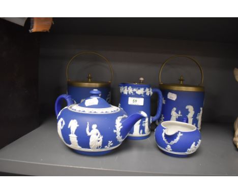 A ceramic tea set by Wedgwood in the Jasperware design in deep blue ground