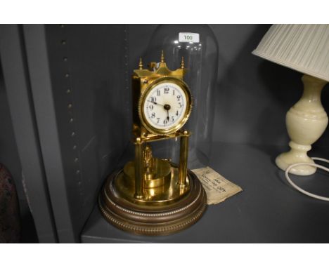 A 400 day anniversary clock having glass dome and German made movement