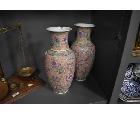 A pair of Chinese vase in a Cantonese palette with extensive enamel work
Both vase in very good condition no signs of damage 