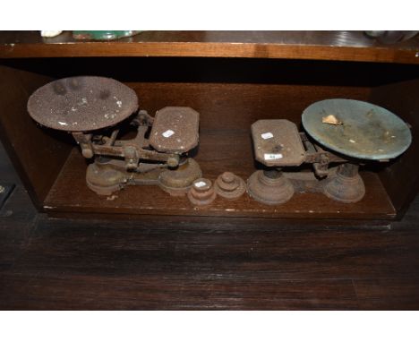 Two sets of vintage kitchen balance scales with some weights
